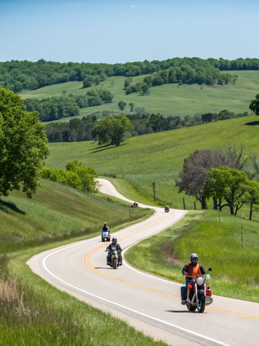 Motorcyclists enjoying a scenic ride through the countryside, highlighting the exploration and discovery aspects of ROAD INDEPENDENT's events.